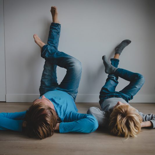 Dad and son relax at home, comfort and family time, parenting